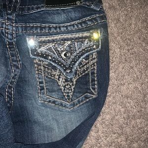 Bedazzled denim capri pants.